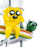 Close up view of Empire Glassworks Land of Ooo Mini Water Pipe showing characters from Adventure Time sliding down a rainbow.