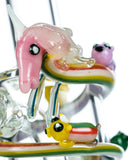 Close up view of Empire Glassworks Land of Ooo Mini Water Pipe showing characters from Adventure Time sliding down a rainbow.